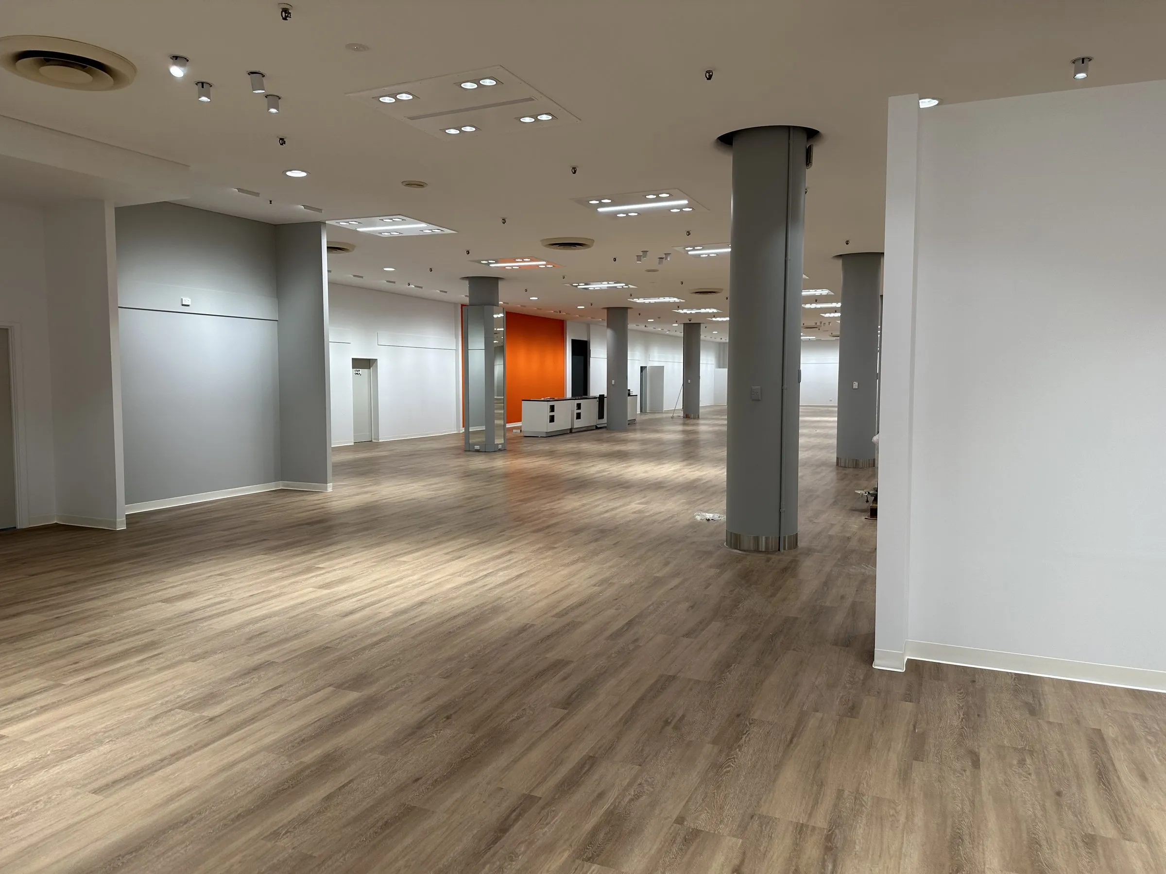 Large empty fit-out floor plate with pillars after the final clean